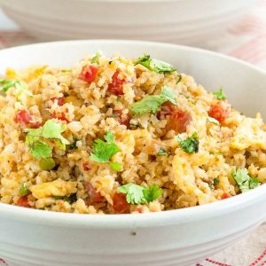 A bowl of cauliflower pork fried rice