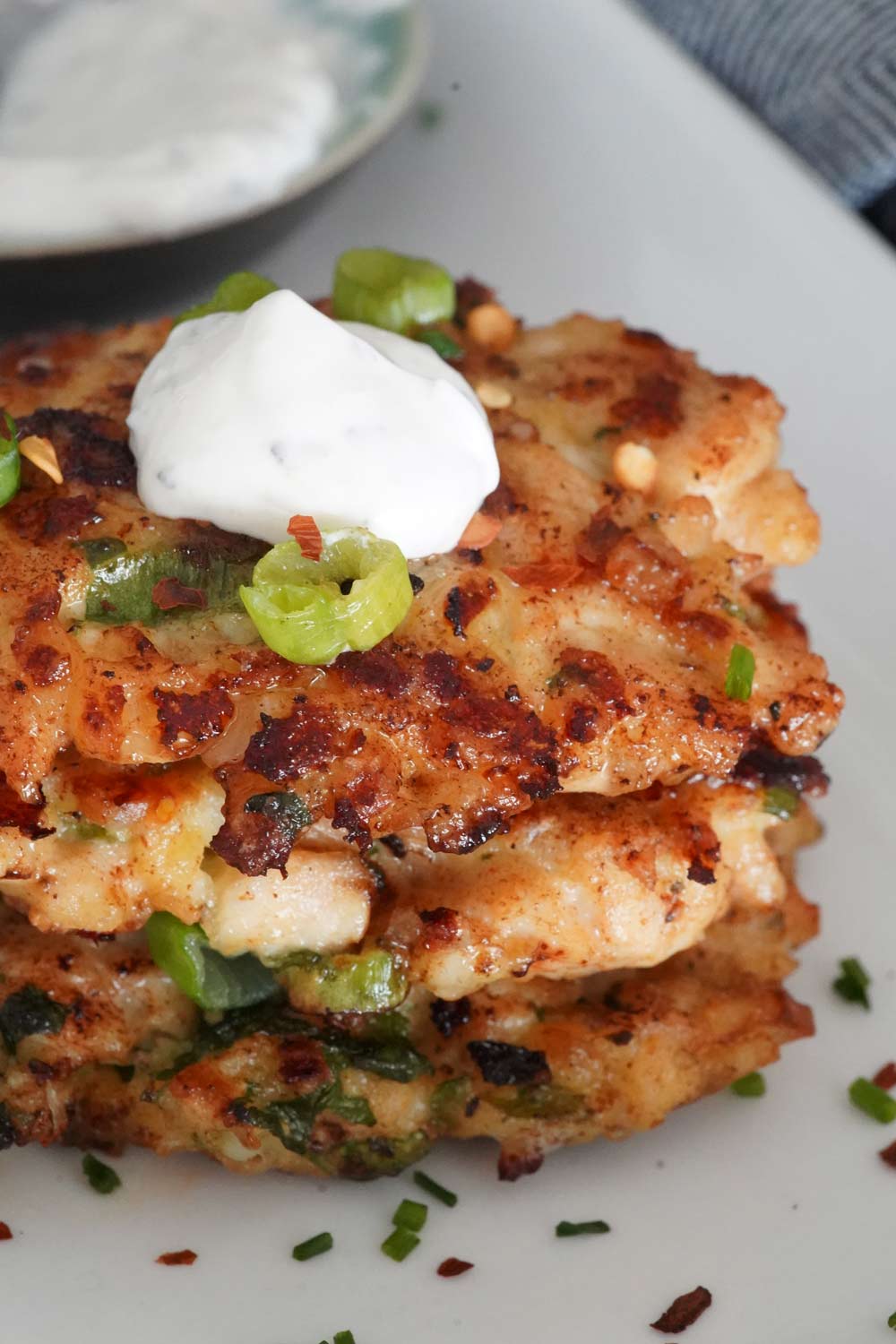 A stack of cheesy chicken fritters