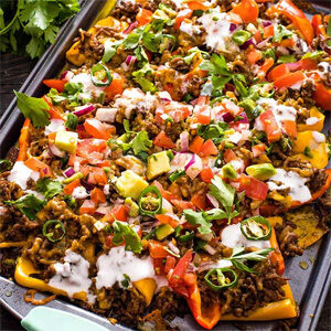 A baking sheet full of mini pepper nachos