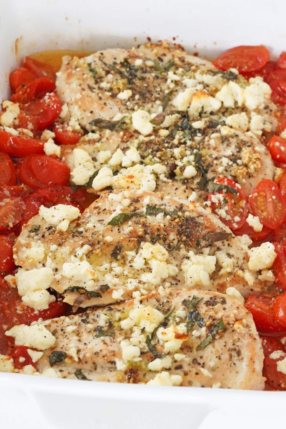 Baked chicken with feta in a casserole dish, baked chicken with feta & tomatoes