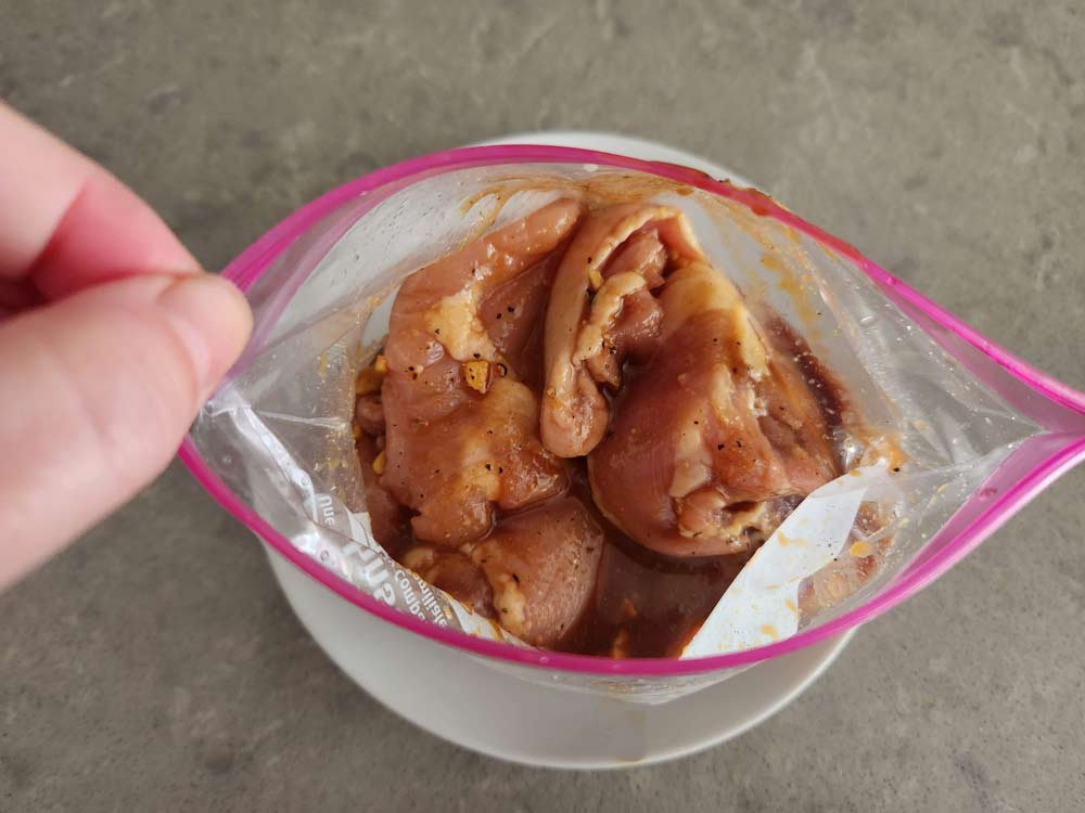 Chicken thighs in the marinade.